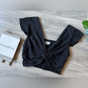 Japna ruffle sleeve knotted front smocked back crop top in black. Size S
